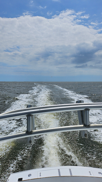 view from bridge of wake of boat. rushing water