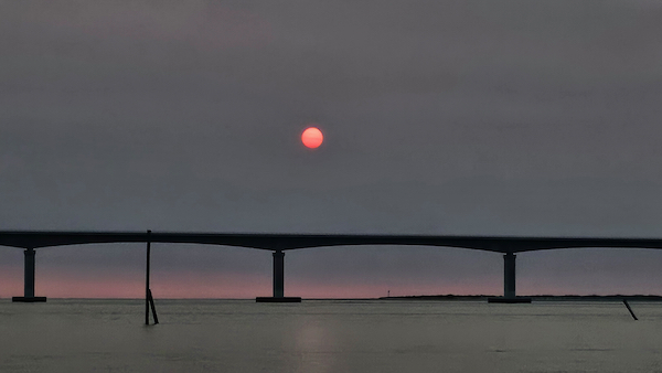 sunrise over oregon inlet bridge