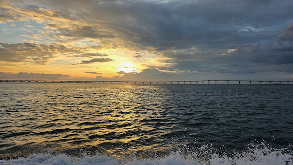 sunrise over ocean gray and orange
